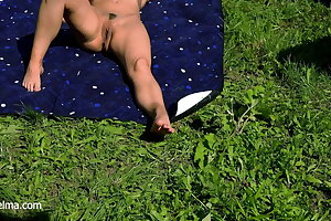 My neighbors' daughter-in-law is tanning nude in the garden